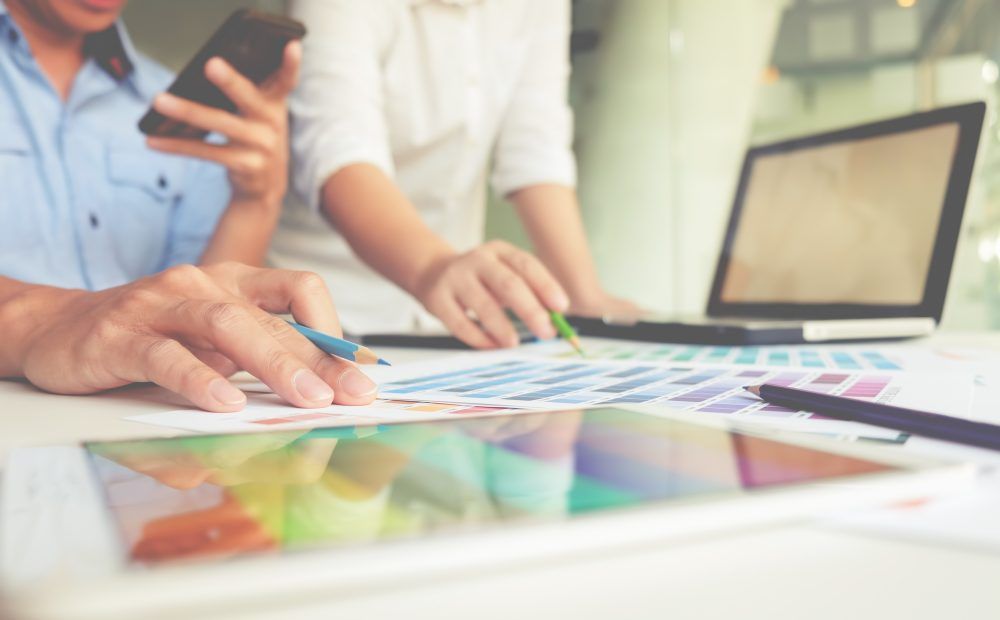 people working on color sheets