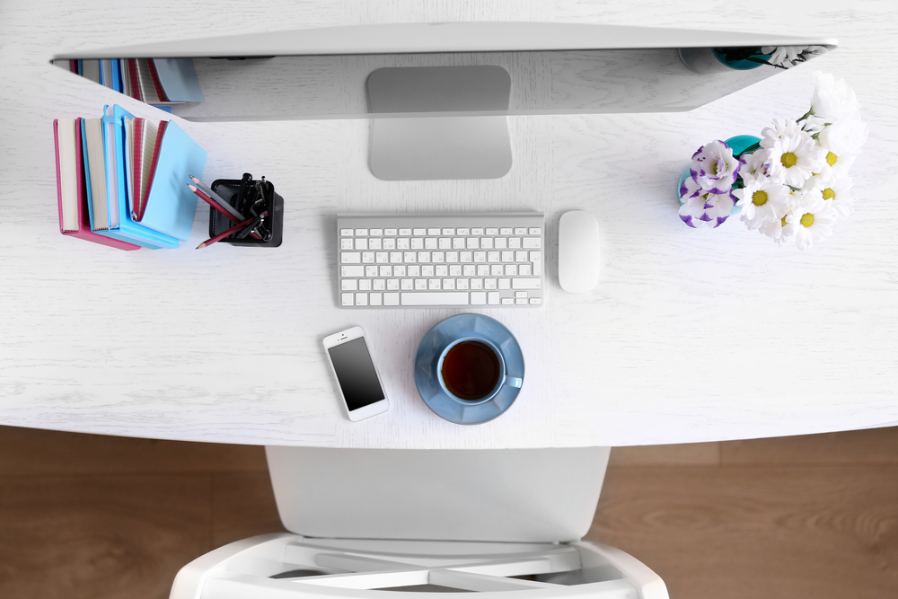 Top view of computer with coffee cup